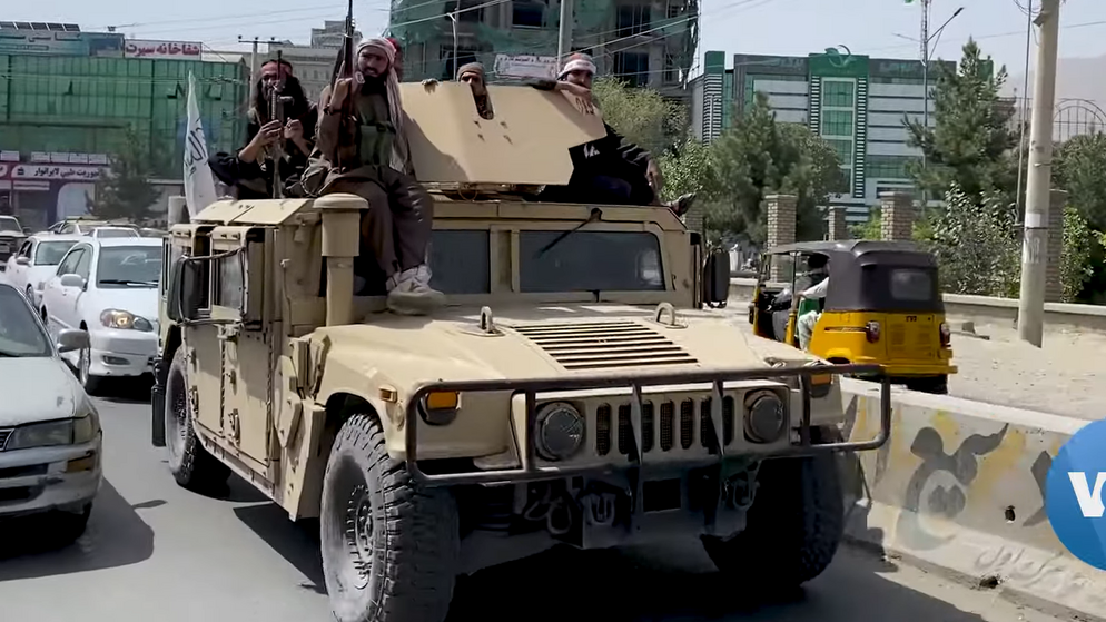 Taliban fighters patrol Kabul streets in a Humvee, 17 August 2021. Voice of America News