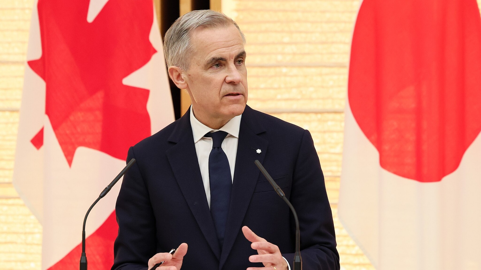 Carney på pressemøde i Japan
